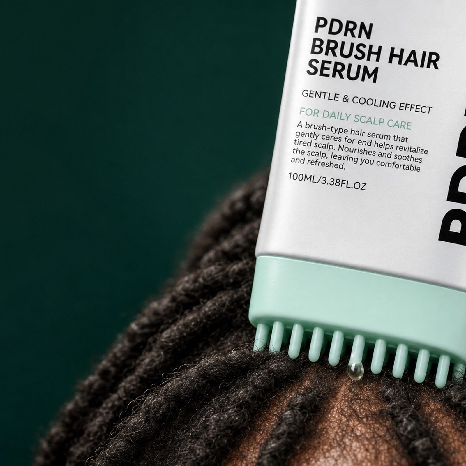 The scalp massage comb built into the cap